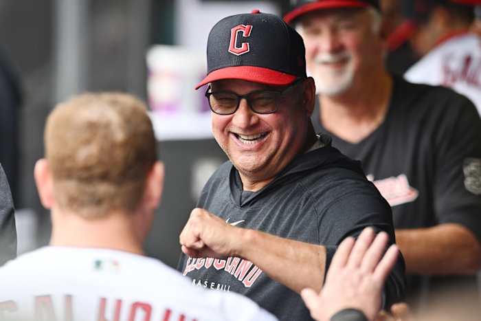 Aug 6, 2023; Cleveland, Ohio, USA; Cleveland Guardians manager Terry Francona celebrates with first baseman Kole Calhoun (56) during the fourth inning at Progressive Field. Mandatory Credit: Ken Blaze-USA TODAY Sports